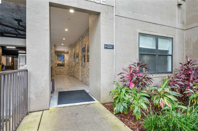 doorway to property with stucco siding