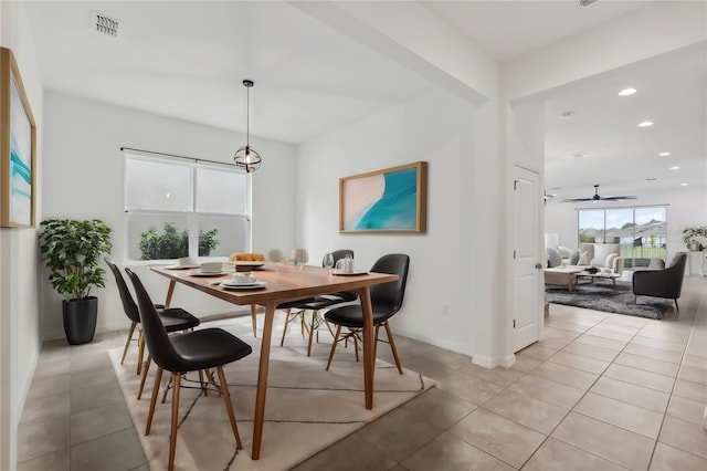 dining area featuring light tile patterned floors and ceiling fan