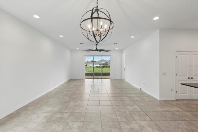 unfurnished room with ceiling fan with notable chandelier and light tile patterned floors