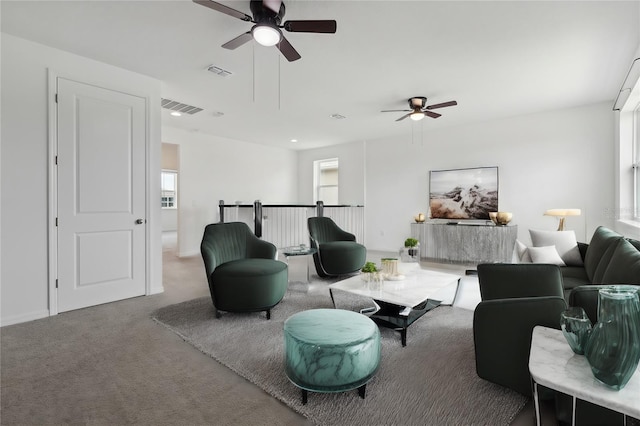 living room featuring ceiling fan and carpet floors