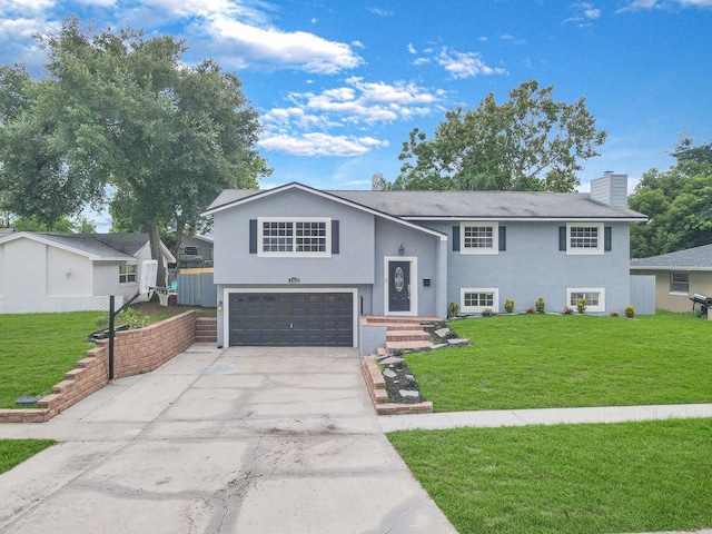 view of front facade featuring a garage and a front yard