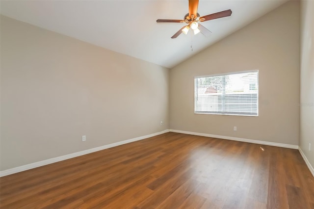 empty room with dark wood-style floors, vaulted ceiling, ceiling fan, and baseboards