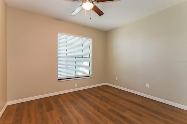 unfurnished room with ceiling fan, baseboards, and wood finished floors