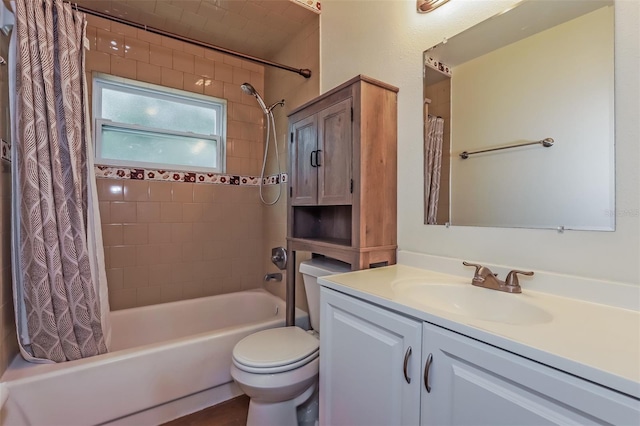 full bathroom featuring vanity, shower / tub combo with curtain, and toilet