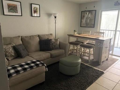 living room featuring light tile patterned floors