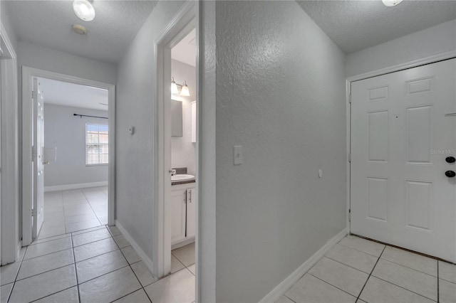 interior space with sink and a textured ceiling