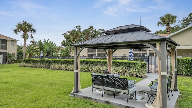 view of community with a gazebo, a patio, and a yard