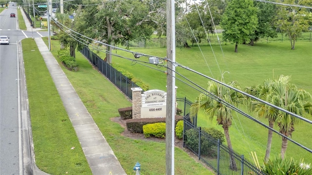 view of property's community featuring a yard