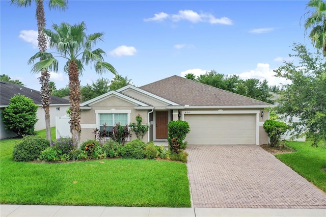 single story home with a garage and a front yard