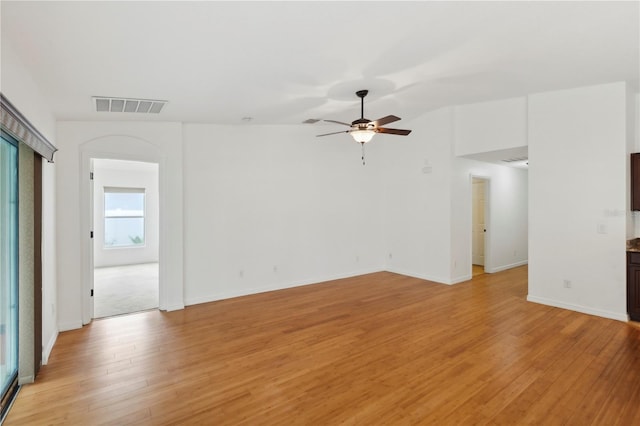 spare room featuring ceiling fan and light hardwood / wood-style flooring