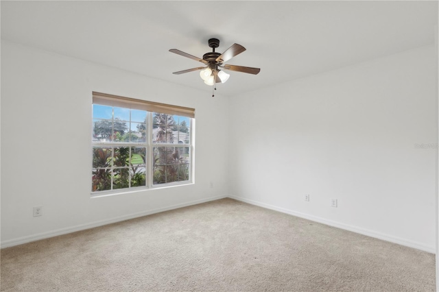 empty room featuring carpet flooring and ceiling fan