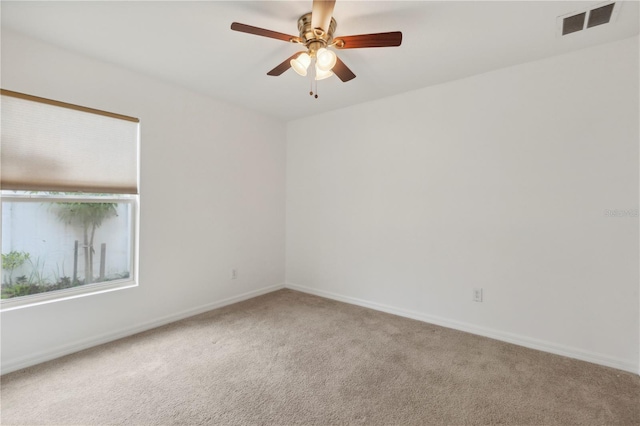 carpeted empty room with ceiling fan