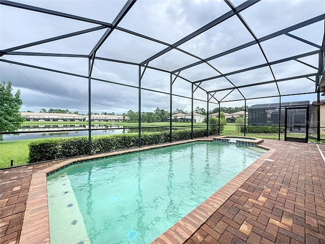 view of swimming pool with a patio area, a water view, a lanai, and a pool with connected hot tub