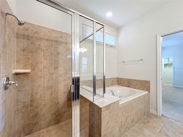 full bath featuring a stall shower, tile patterned floors, and a bath