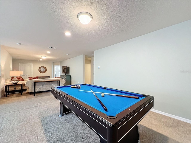 playroom featuring a textured ceiling, light carpet, pool table, visible vents, and baseboards