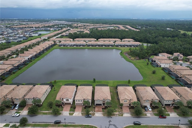 birds eye view of property with a water view and a residential view