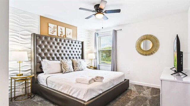 carpeted bedroom with ceiling fan