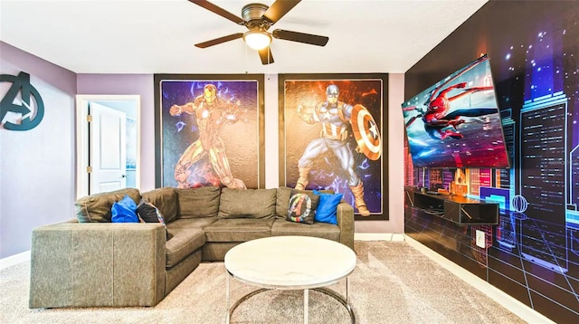 living room featuring carpet flooring, ceiling fan, and baseboards