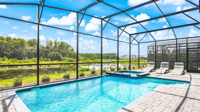 view of pool featuring an in ground hot tub, a patio area, and a lanai