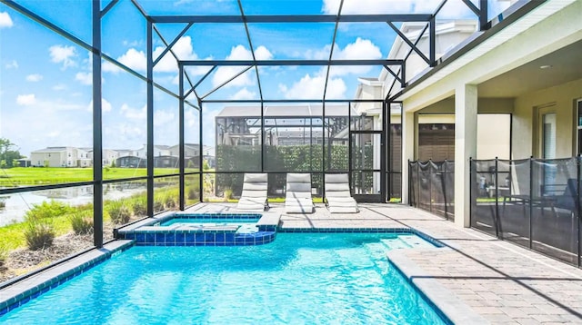 view of pool with glass enclosure, an in ground hot tub, and a patio area