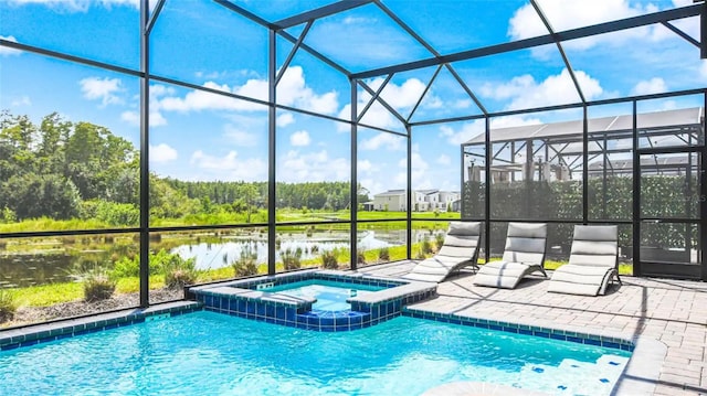 view of pool with glass enclosure and an in ground hot tub