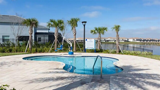 view of swimming pool with a patio area