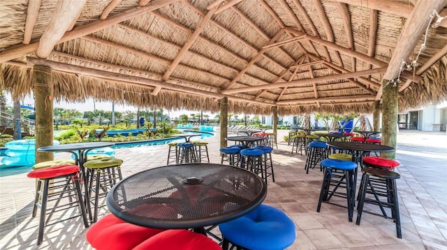 view of patio with a gazebo and a community pool