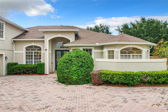 mediterranean / spanish-style house featuring french doors