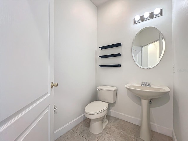 bathroom with tile patterned floors and toilet