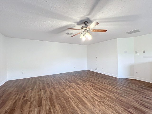 unfurnished room featuring a textured ceiling, dark hardwood / wood-style floors, and ceiling fan