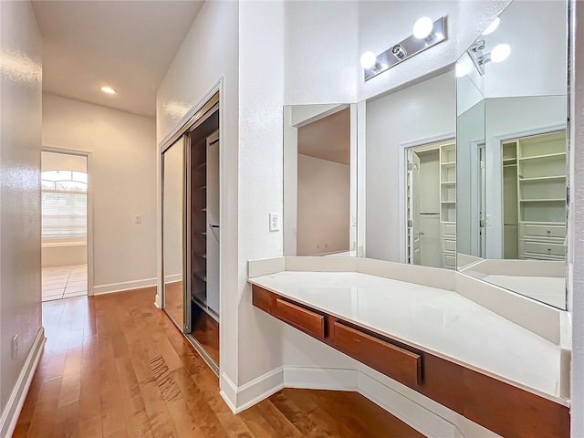 bathroom with hardwood / wood-style floors