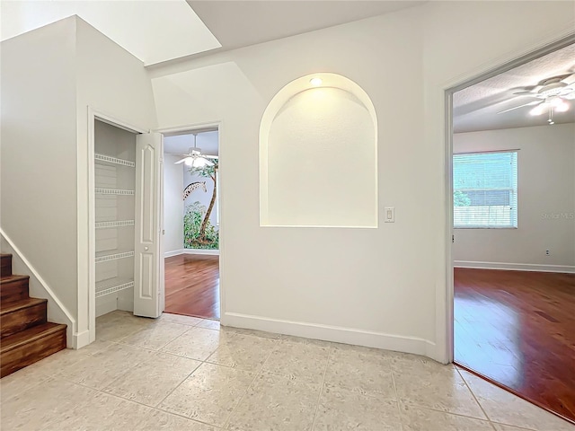 interior space featuring ceiling fan