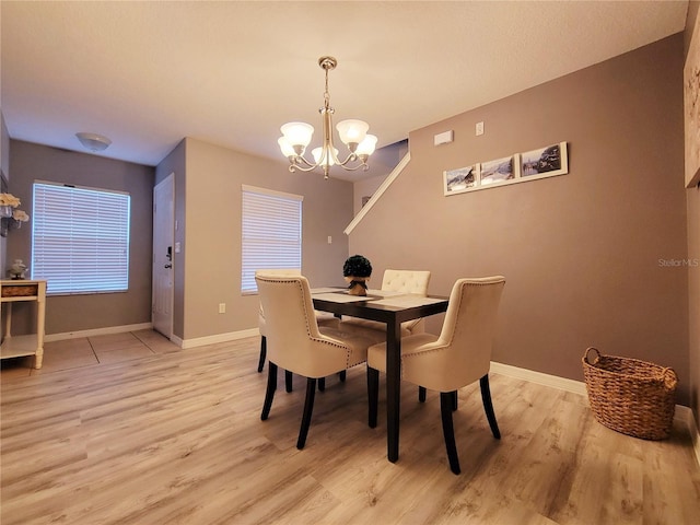 dining room featuring a chandelier and light hardwood / wood-style floors