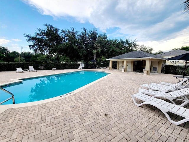 view of swimming pool with a patio area