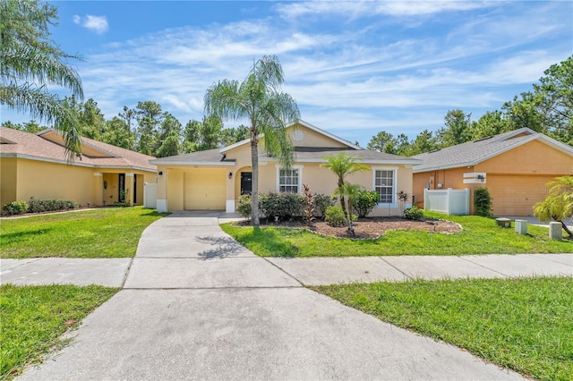 ranch-style house with a garage and a front lawn