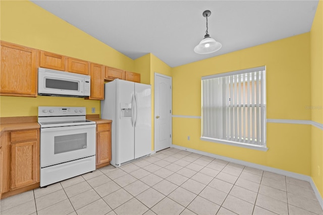 kitchen featuring vaulted ceiling, hanging light fixtures, white appliances, and light tile patterned floors