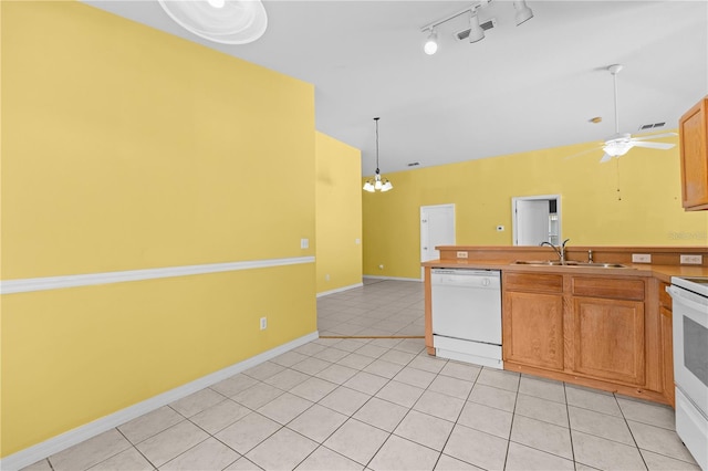 kitchen featuring sink, dishwasher, ceiling fan with notable chandelier, and light tile patterned floors