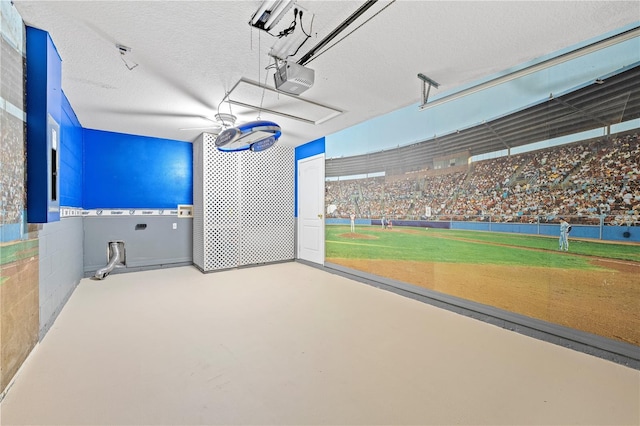 interior space featuring a garage door opener and a lawn