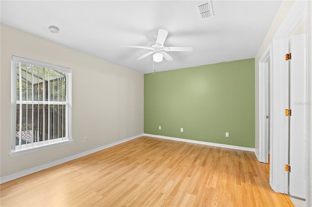 unfurnished bedroom with ceiling fan and light wood-type flooring