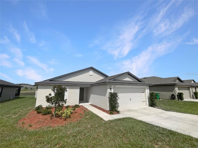 ranch-style home with a front yard and a garage