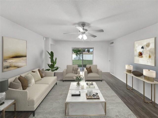 living room with ceiling fan and dark hardwood / wood-style floors