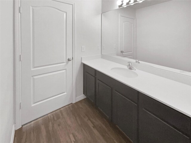 bathroom featuring hardwood / wood-style floors and vanity