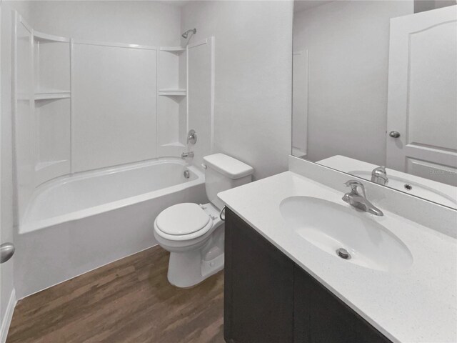 full bathroom featuring bathtub / shower combination, toilet, vanity, and wood-type flooring