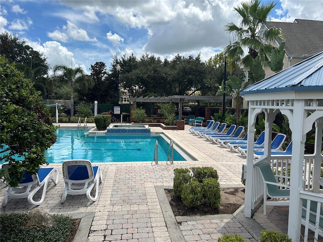 view of swimming pool featuring a gazebo and a patio area