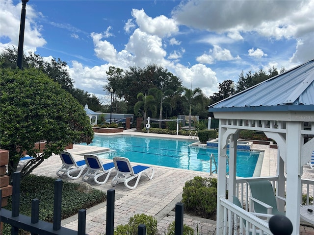 view of pool with a patio area and a gazebo