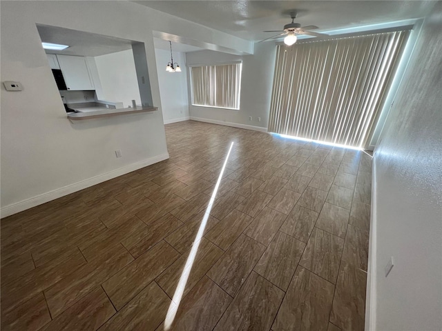 empty room with hardwood / wood-style flooring and ceiling fan