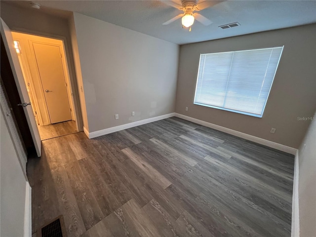 spare room featuring ceiling fan and hardwood / wood-style flooring