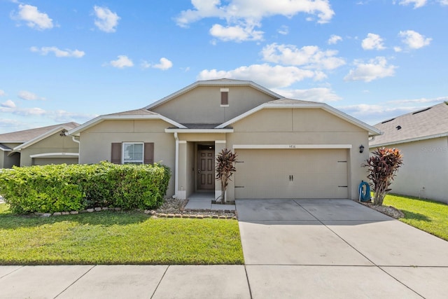 ranch-style home with a front yard and a garage