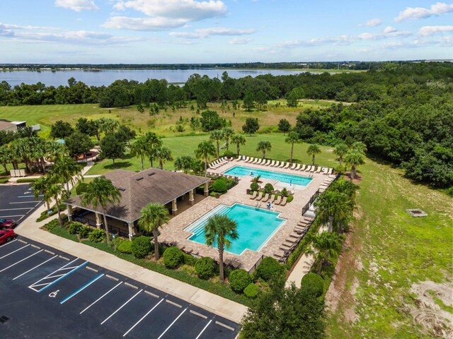 birds eye view of property with a water view