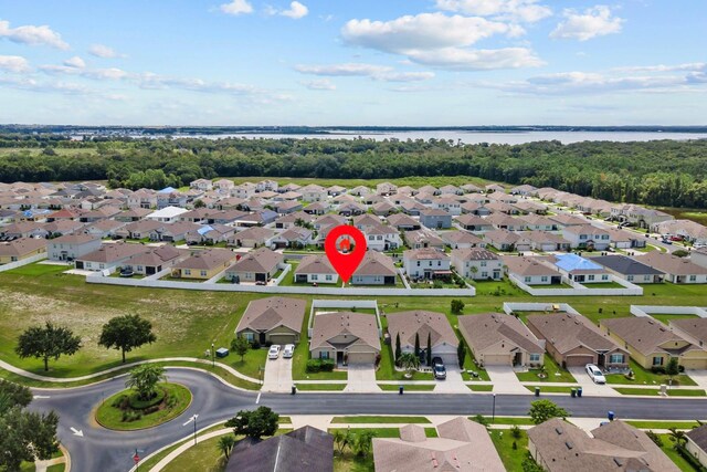 birds eye view of property featuring a residential view and a water view